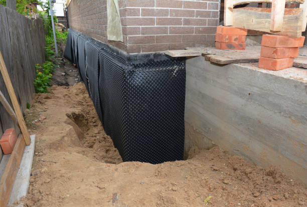SJ Waterproofing Pros technician performing targeted Interior Drainage System assessment in Napoleon, MI